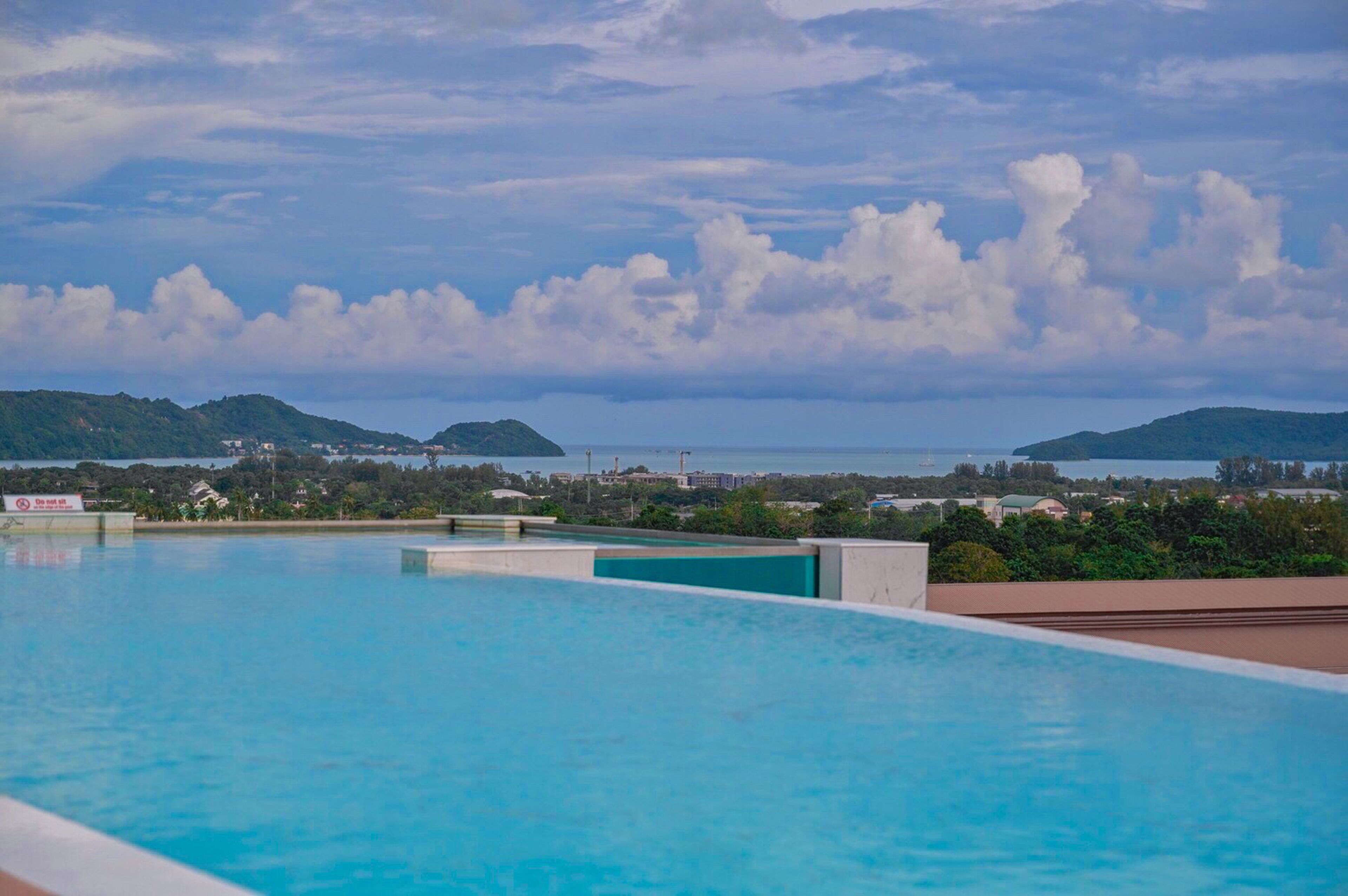 outdoor pool, open 8:00 am to 8:00 pm, pool loungers