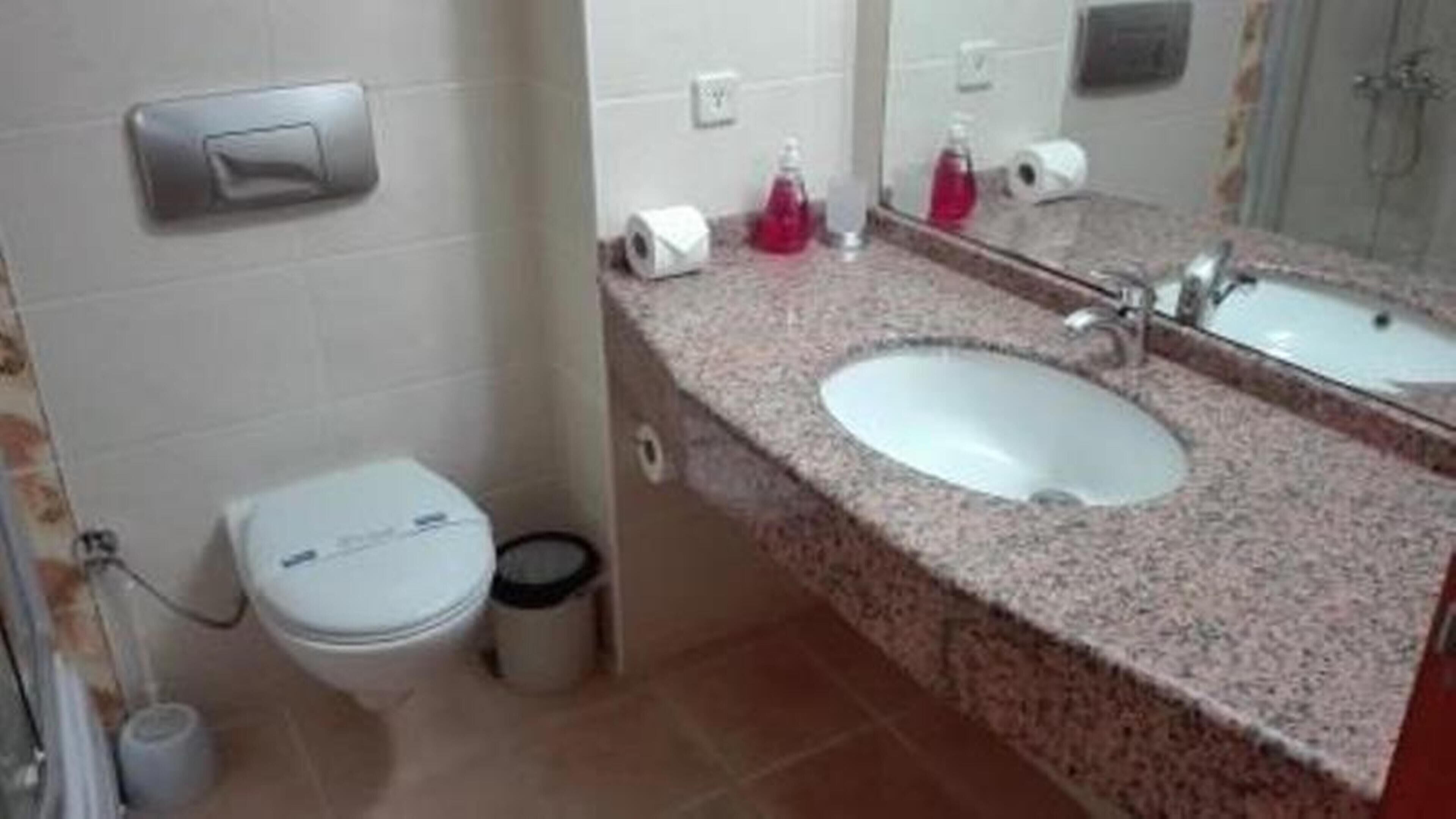Bathroom | Shower, hair dryer, slippers, towels