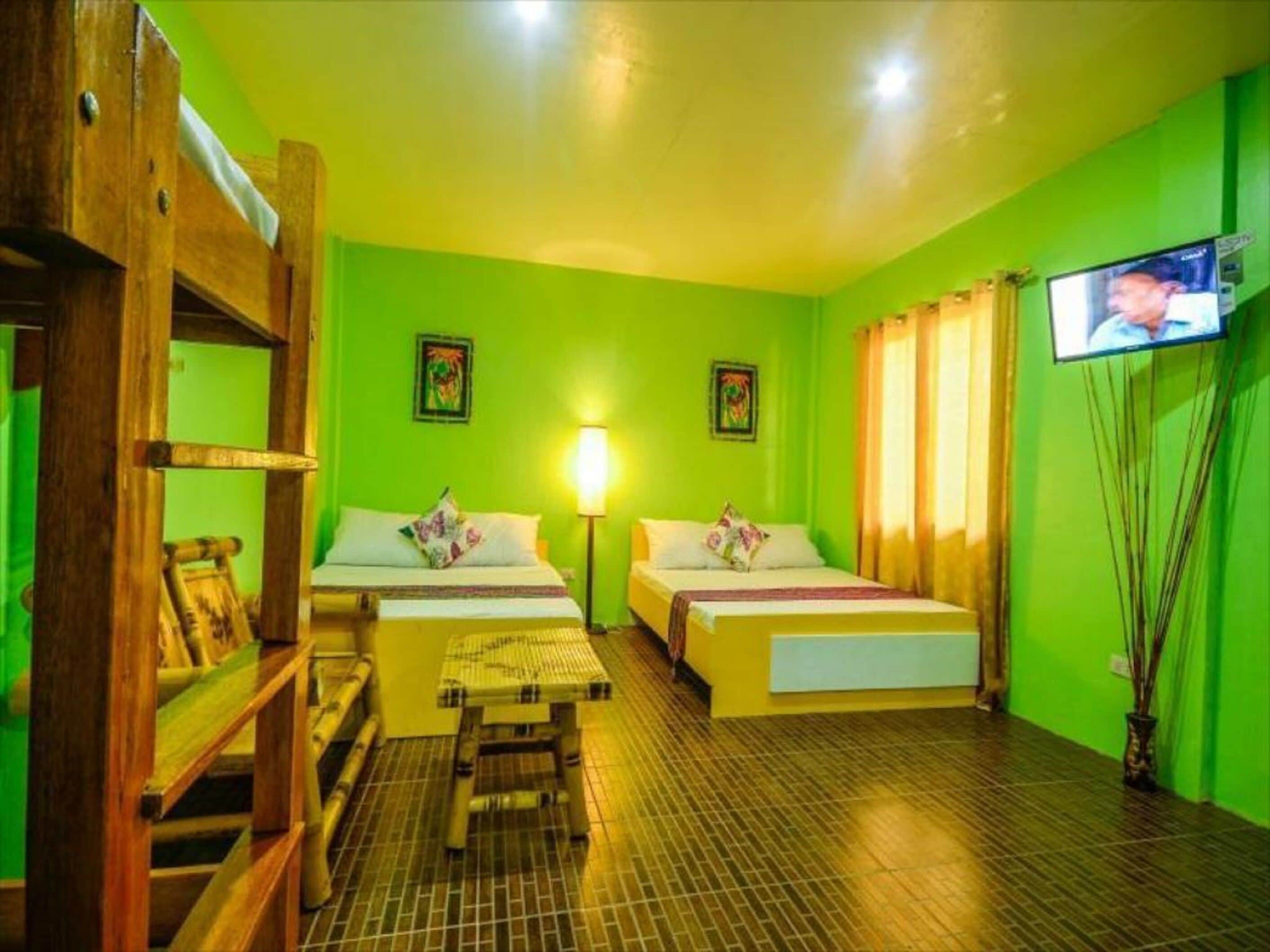 Standard Room, Multiple Beds | Living area | 32-inch LCD TV with cable channels, TV