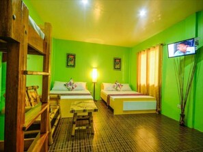 Standard Room, Multiple Beds | Living area | 32-inch LCD TV with cable channels, TV
