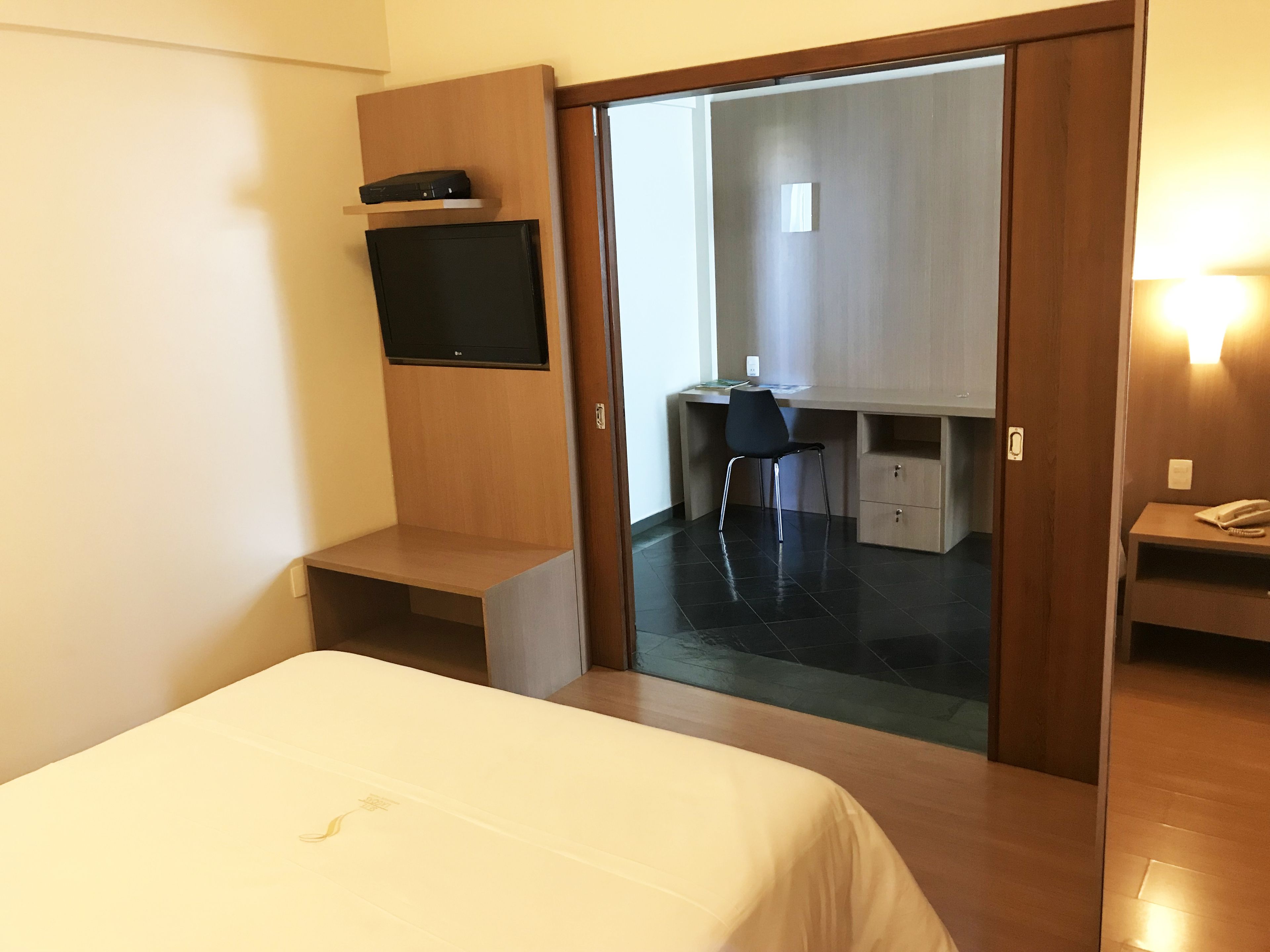 minibar, desk, blackout curtains, iron/ironing board