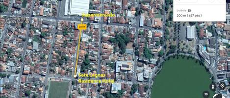 A satellite view of a residential area with a marked distance of 200 meters to a location labeled "Residence Hotel."