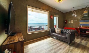 Superior Room (Indoor Jacuzzi B) | Living area | LED TV, pay movies