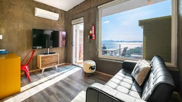 Deluxe Room (Outdoor Jacuzzi A) | Living area | LED TV, pay movies