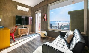 Deluxe Room (Outdoor Jacuzzi A) | Living area | LED TV, pay movies