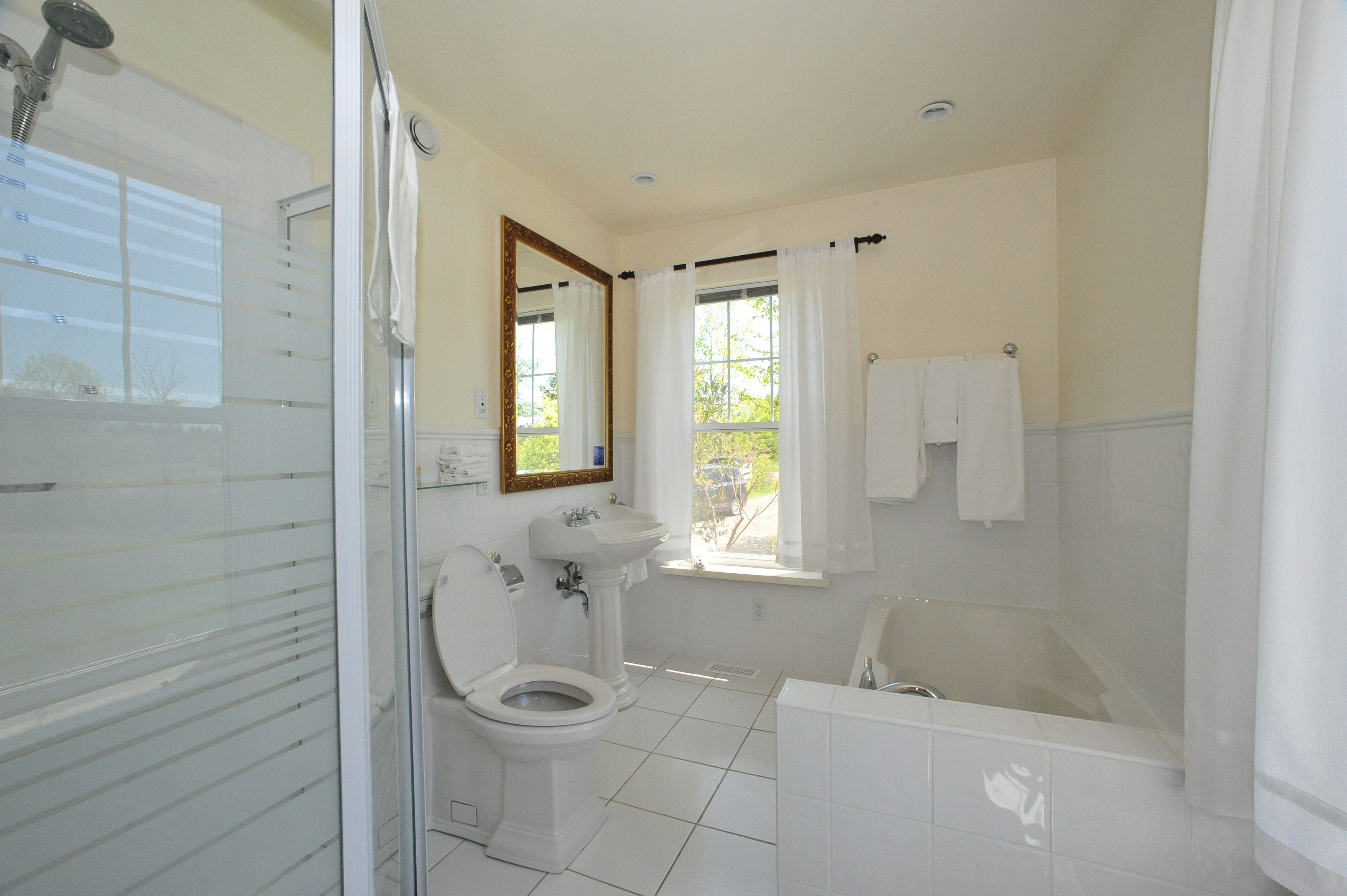 luxury suite, 1 queen bed | bathroom | free toiletries, hair dryer, bathrobes, towels