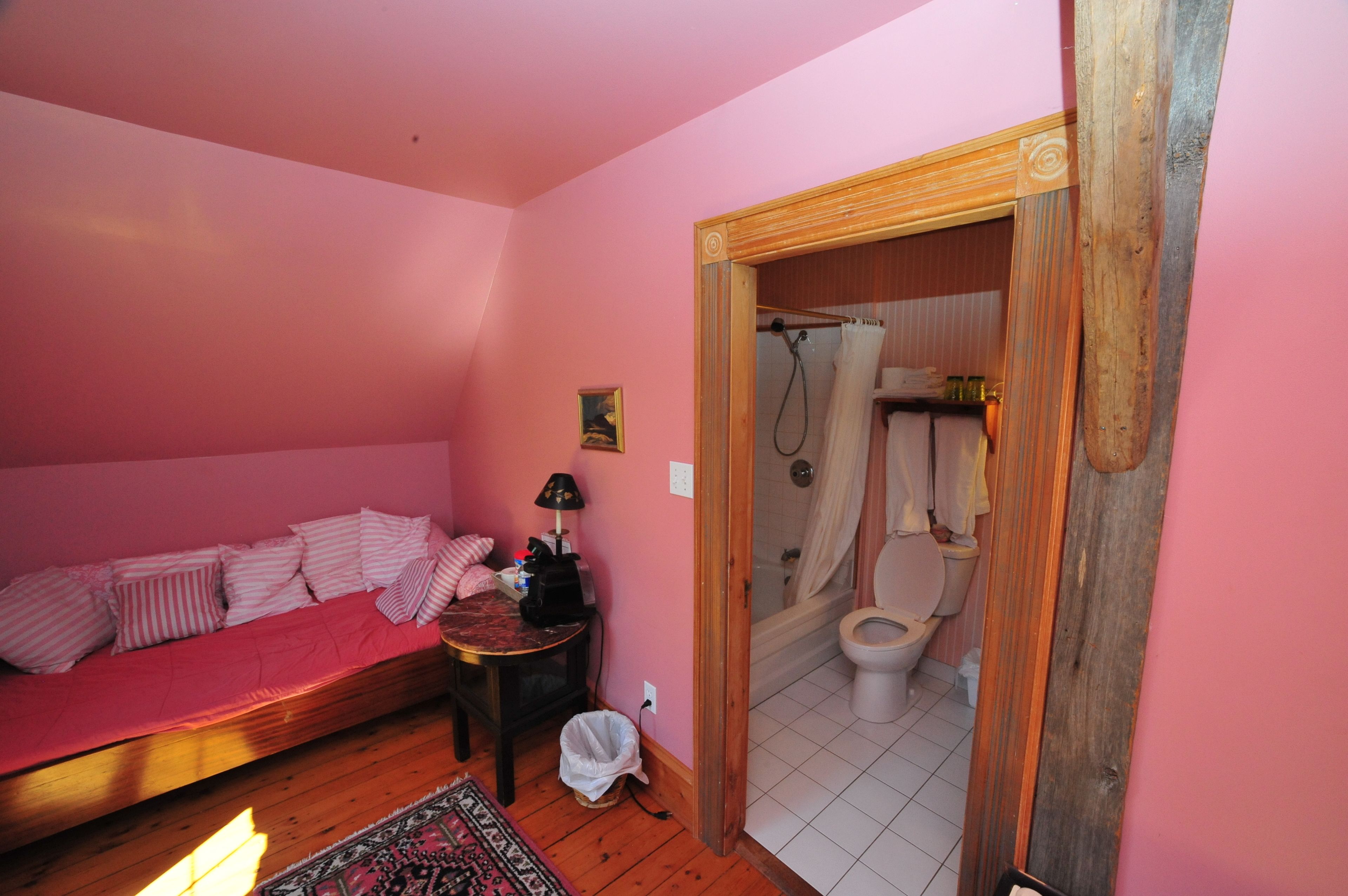 family room (one king bed and one single bed) | bathroom | free toiletries, hair dryer, bathrobes, towels