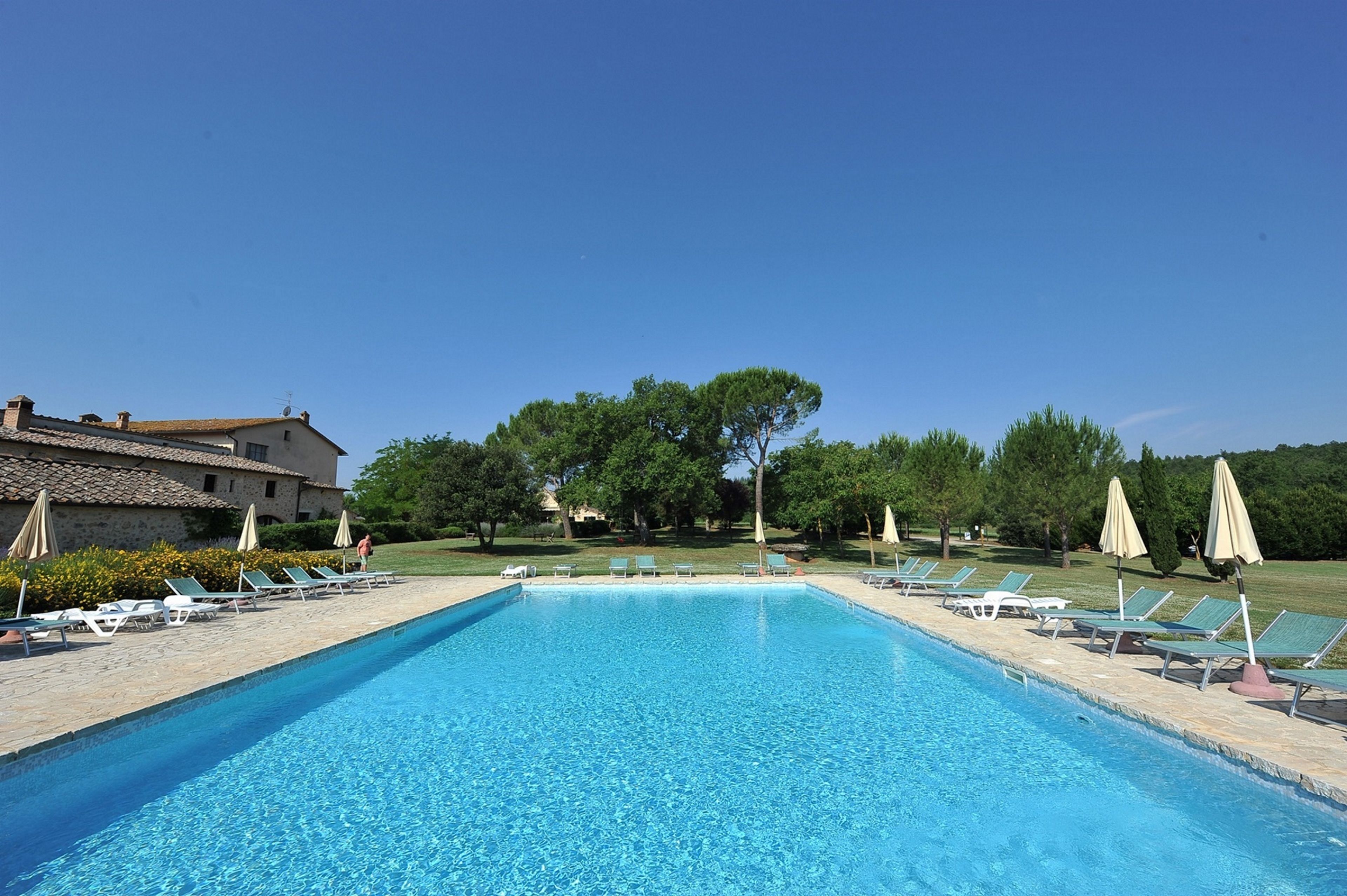 Seasonal outdoor pool, open 9:00 AM to 8:00 PM, pool umbrellas