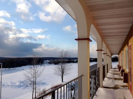 Hypo-allergenic bedding, desk, laptop workspace, blackout drapes