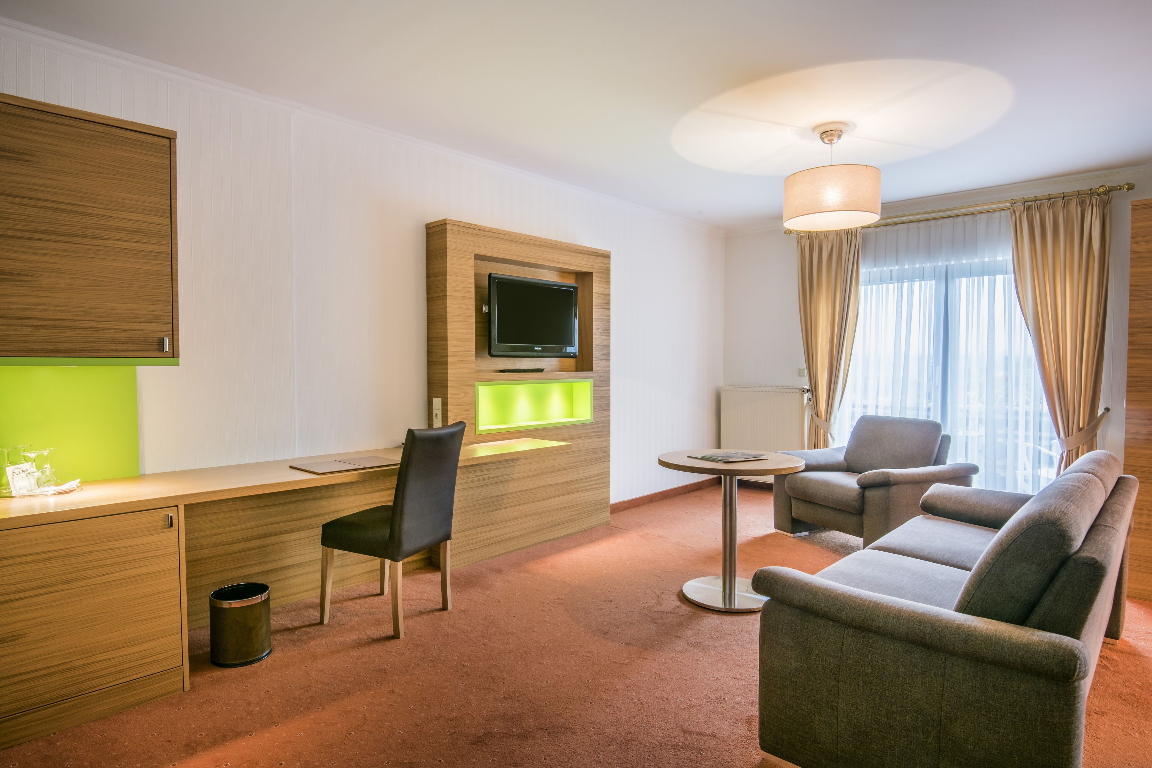 junior suite, 1 king bed, lake view | living room | tv