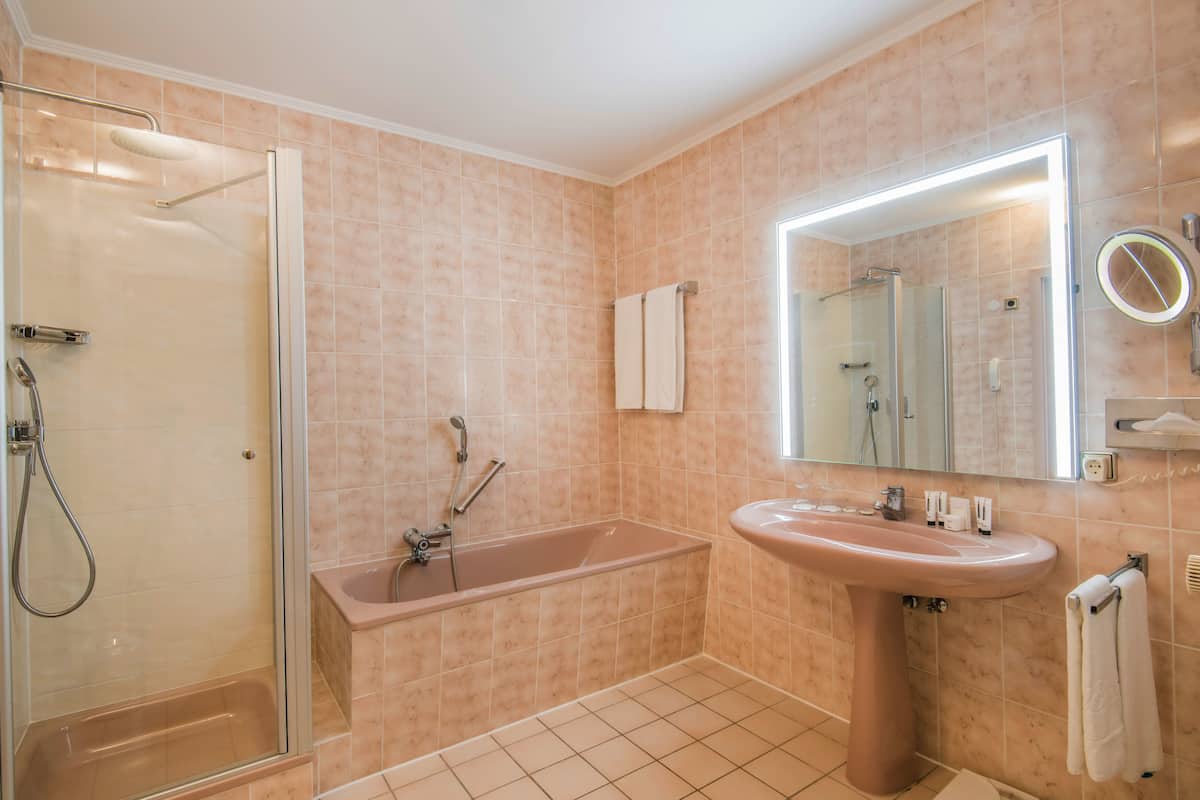 shower, hair dryer, bathrobes, slippers