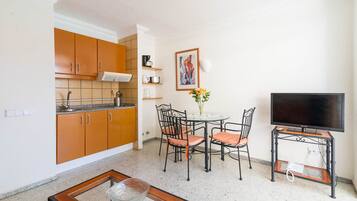 Apartment, Balcony, Pool View | Private kitchen | Full-size fridge, stovetop, coffee/tea maker, electric kettle