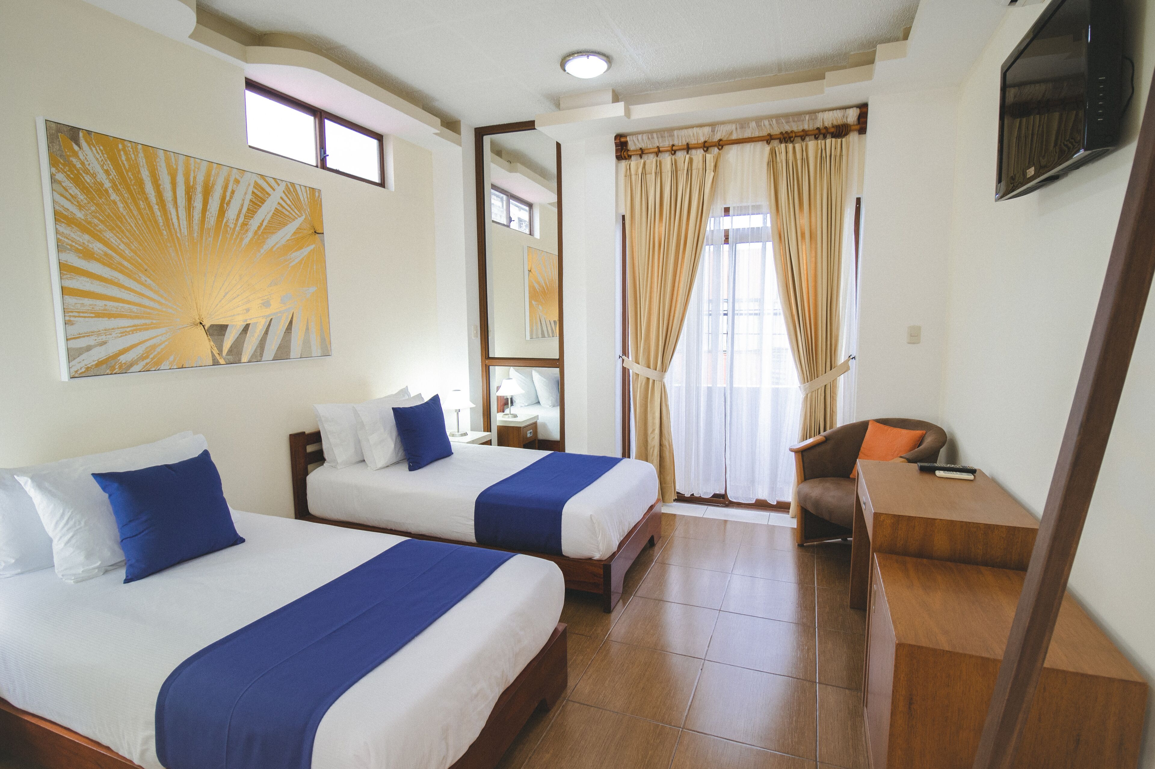 deluxe room, 1 bedroom, bathtub, tower | in-room safe, laptop workspace, free wifi, bed sheets