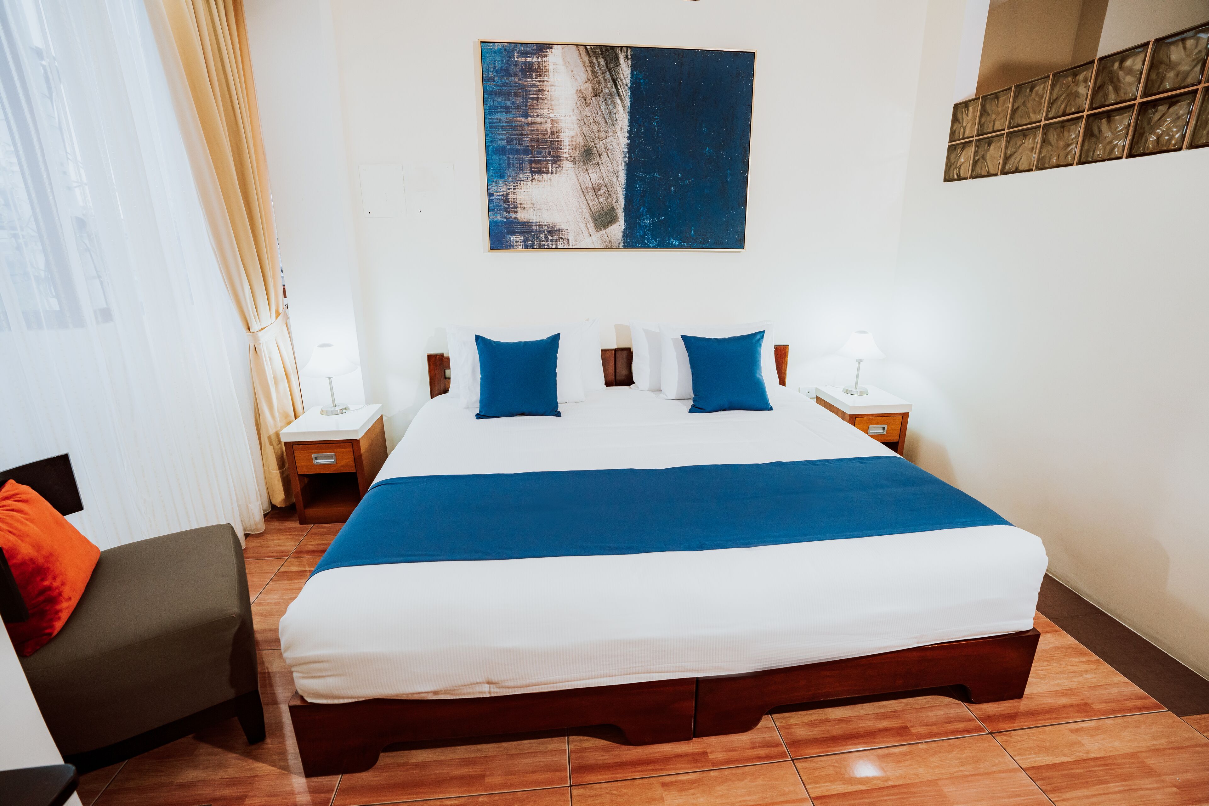 deluxe room, 1 bedroom, bathtub, tower | in-room safe, laptop workspace, free wifi, bed sheets