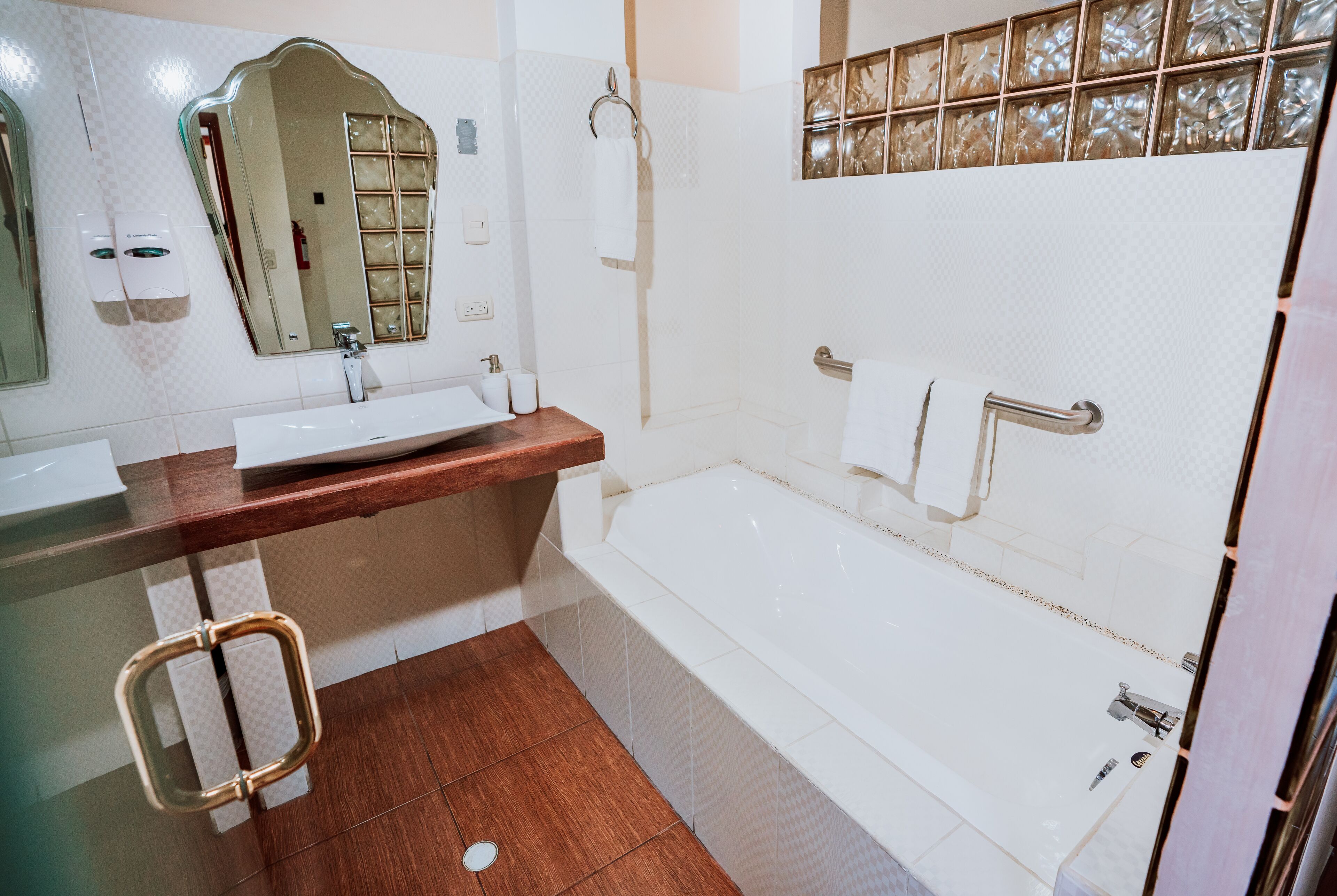 deluxe room, 1 bedroom, bathtub, tower | bathroom | hair dryer, towels, soap, shampoo
