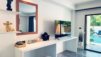 Deluxe Room, Pool Access | Living area | 55-inch flat-screen TV with satellite channels, TV