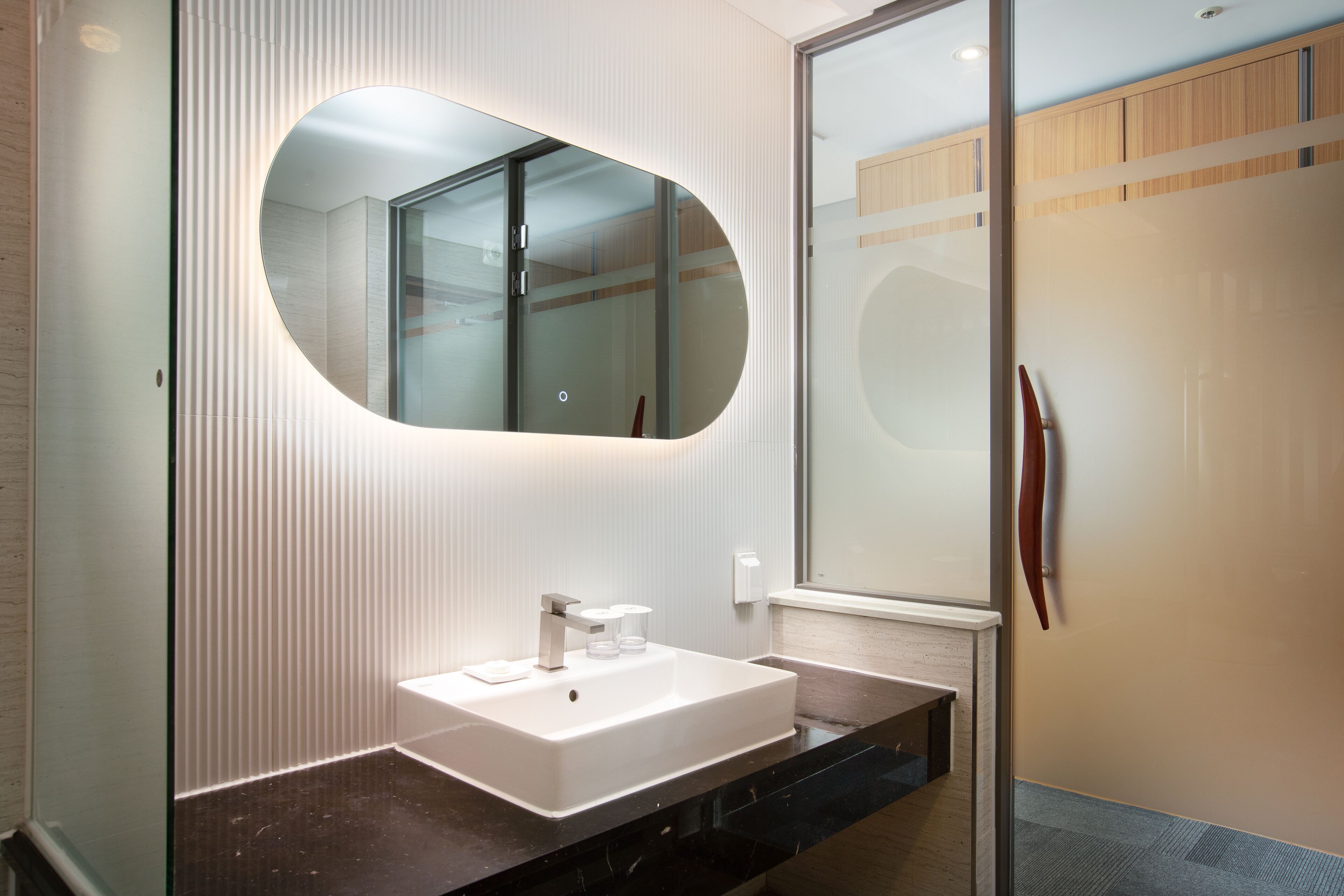 separate bathtub and shower, hair dryer, slippers, bidet