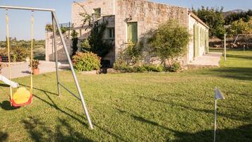 Experience a serene retreat amidst lush greenery and rustic charm.