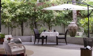 Breakfast, lunch served; local and international cuisine, garden views 