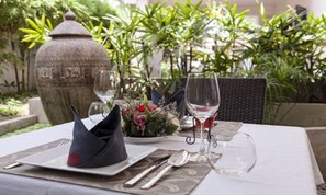 Breakfast, lunch served; local and international cuisine, garden views 