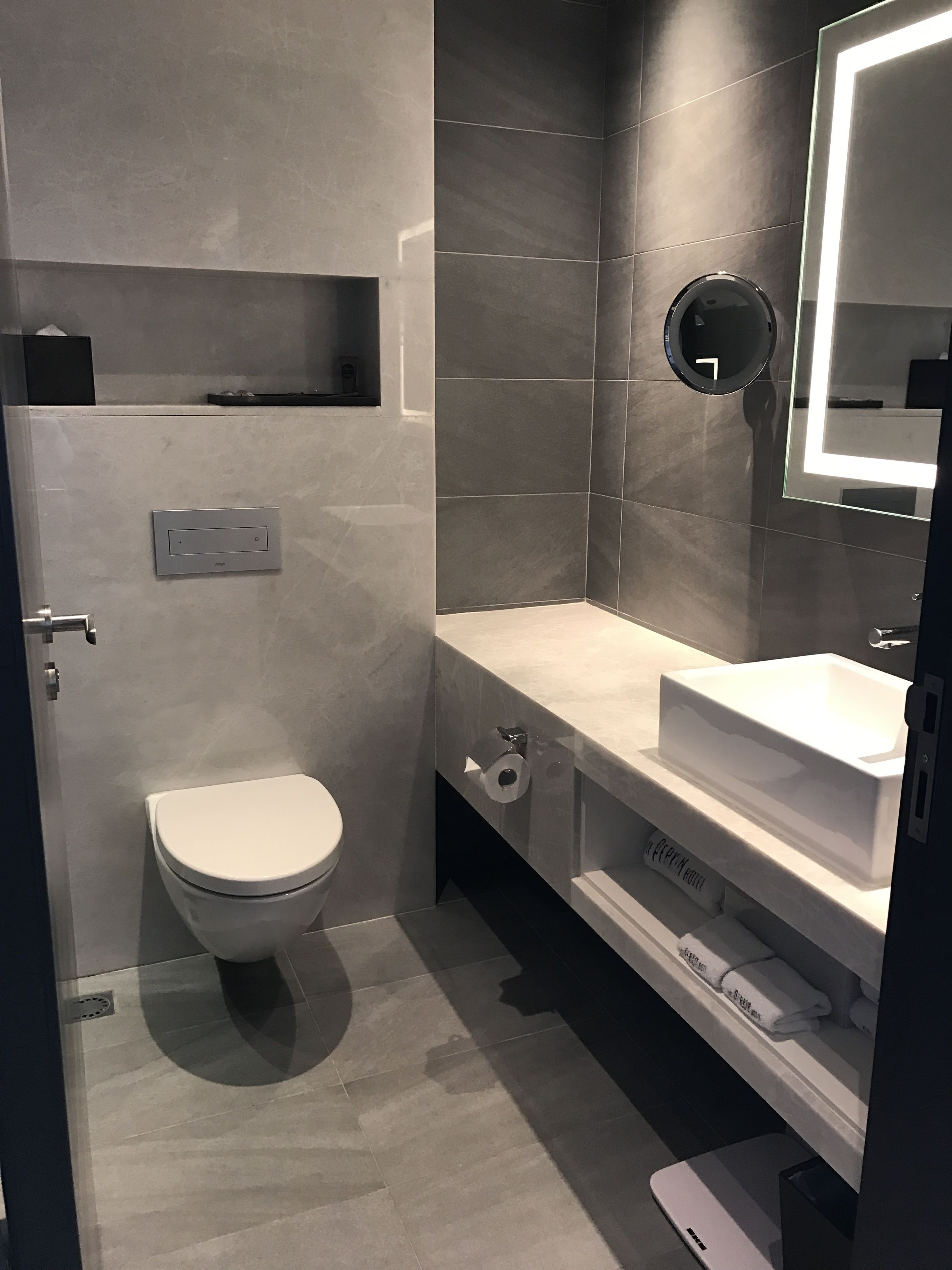 deluxe queen room | bathroom | shower, rainfall showerhead, hair dryer, slippers