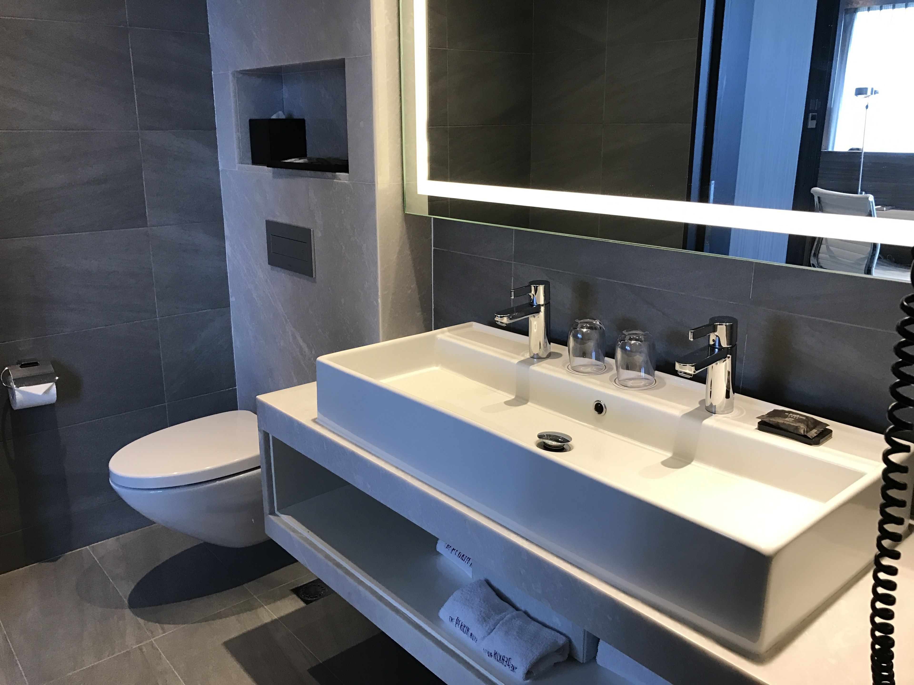 perkin grand king room | bathroom | shower, rainfall showerhead, hair dryer, slippers