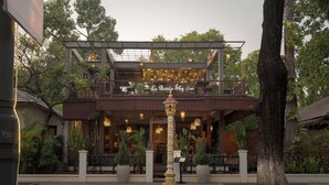 A building with a balcony and a sign that reads 'La Rivière Sky Bar'. - La Rivière d' Angkor Resort (Siem Reap)