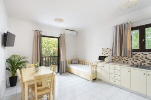 Family Apartment, 2 Bedrooms | Living area | Flat-screen TV