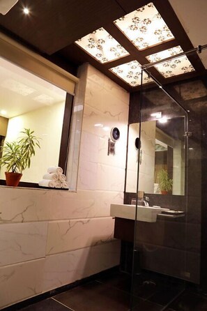 Shower, free toiletries, hair dryer, slippers