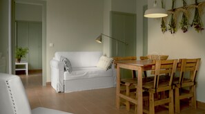 Apartment, 1 Bedroom, Balcony | Living room | Flat-screen TV