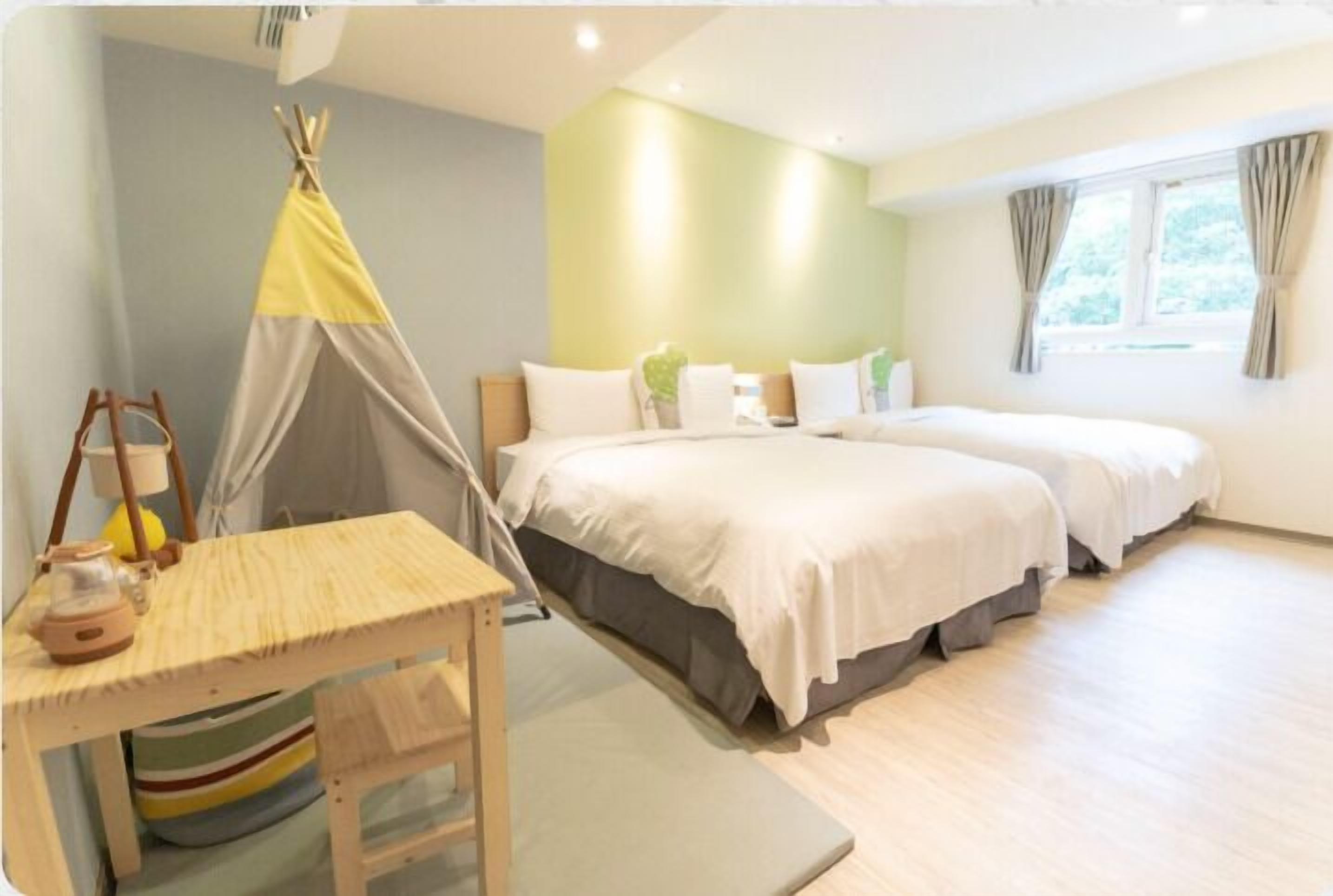 Family Room | Down comforters, desk, blackout drapes, soundproofing