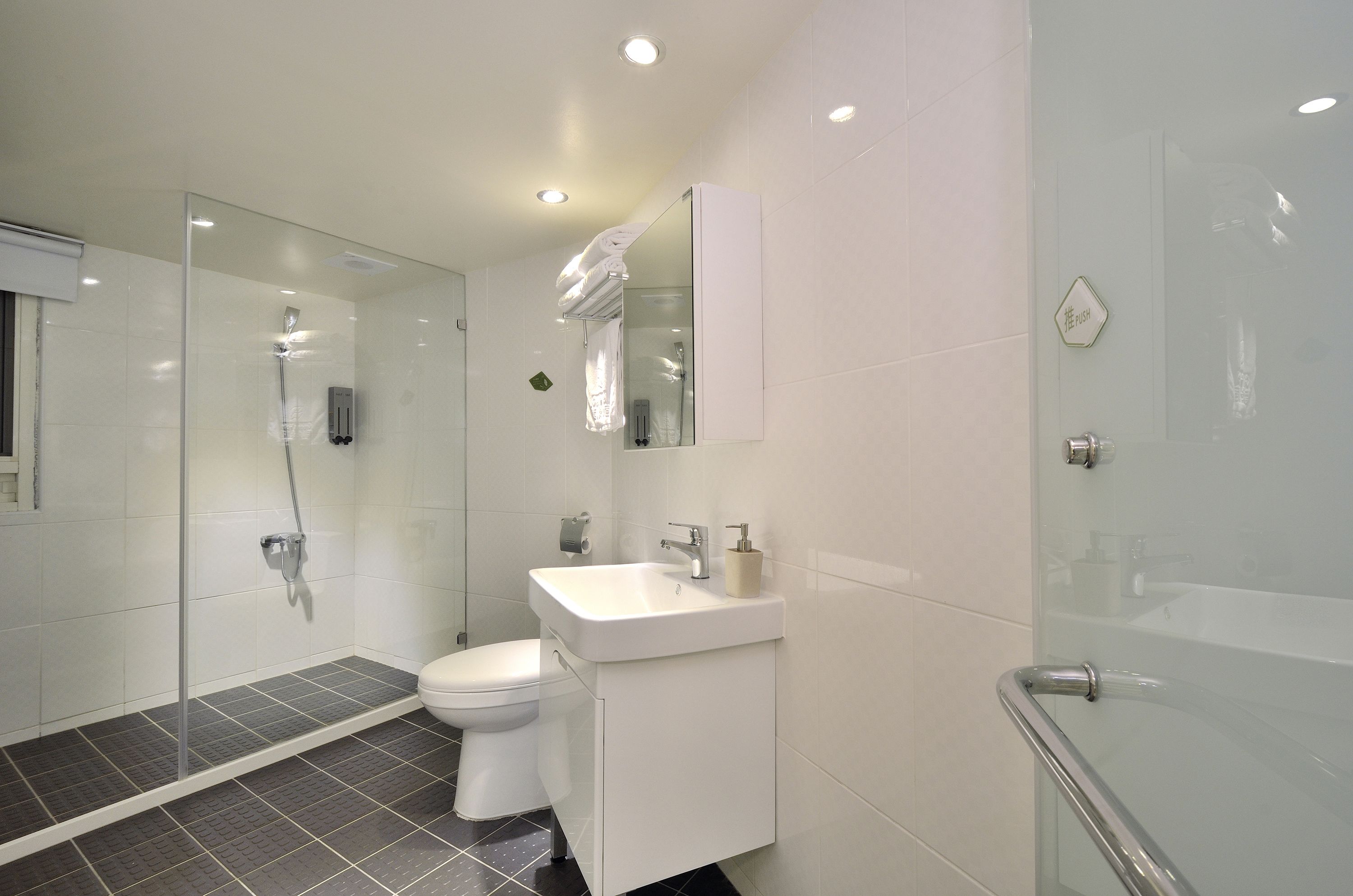 family room | bathroom | shower, rainfall showerhead, free toiletries, hair dryer