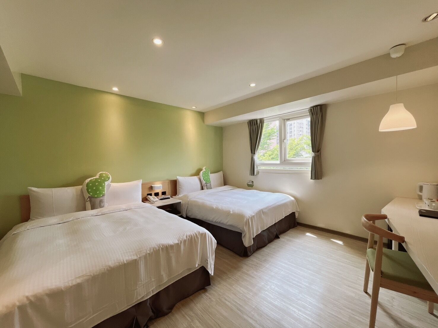 Family Room | Down duvets, desk, blackout curtains, soundproofing