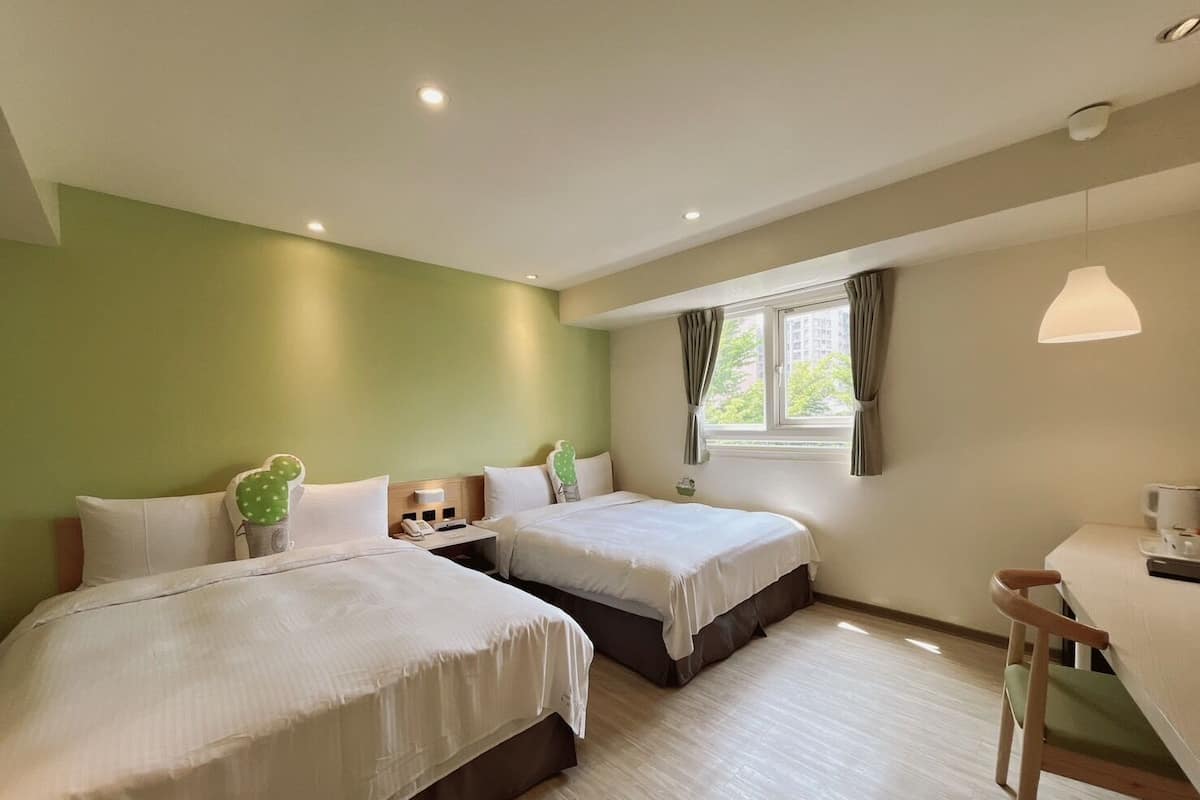 Family Room | Down duvets, desk, blackout curtains, soundproofing