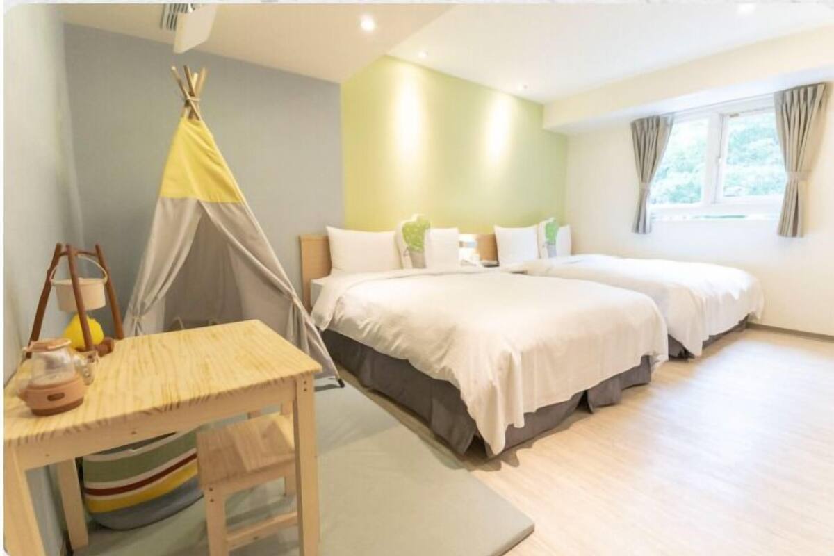 Family Room | Down comforters, desk, blackout drapes, soundproofing