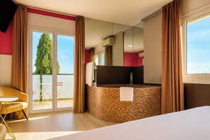 Suite supérieure, 1 très grand lit, baignoire à remous (Balcón) | Rideaux d’obscurcissement, accès au Wi-Fi (inclus)