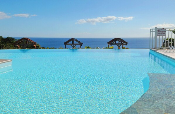 Outdoor pool, pool umbrellas, pool loungers