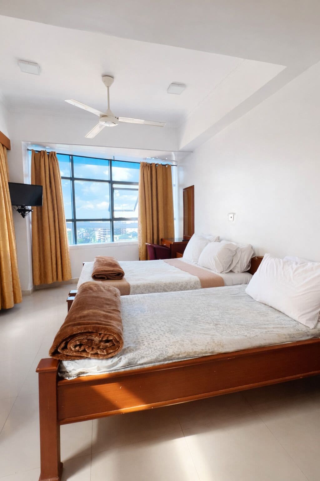 Desk, laptop workspace, blackout drapes, iron/ironing board