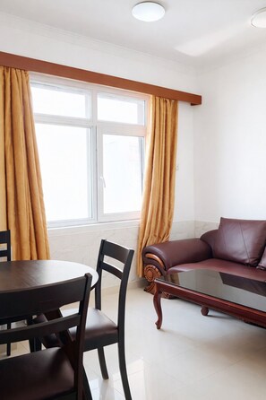 Executive Apartment | Living area | TV - Rainbow Hotel (Dar es Salaam)