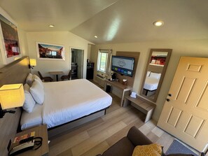 Premium bedding, laptop workspace, blackout drapes, soundproofing