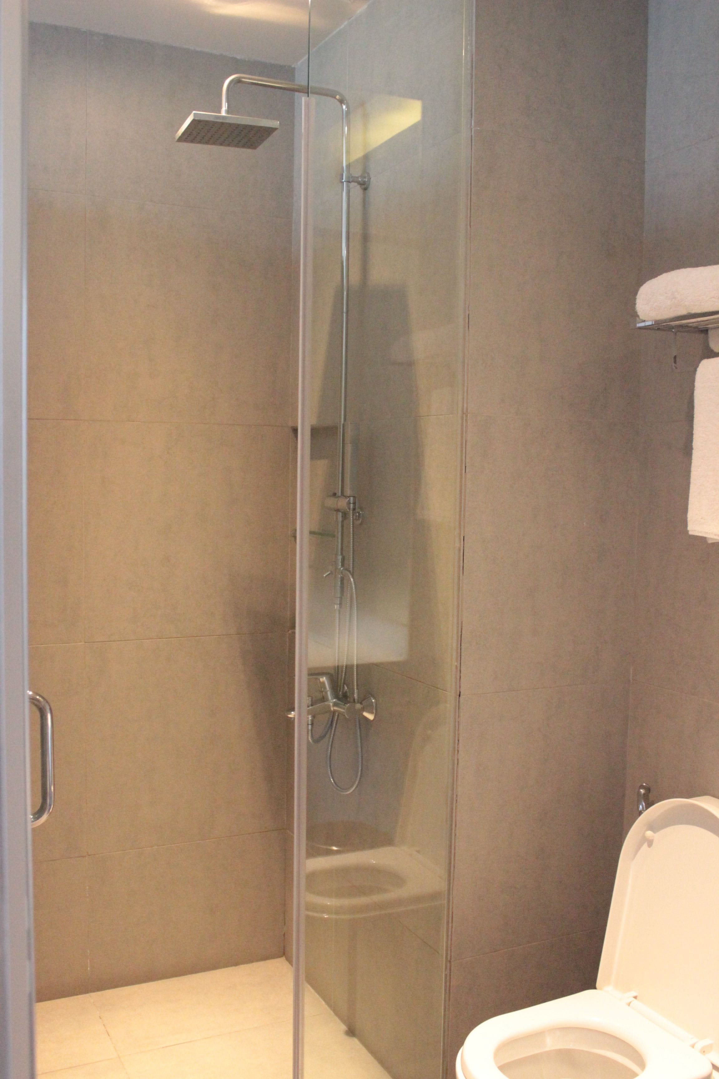 executive twin room | bathroom | shower, rainfall showerhead, free toiletries, hair dryer