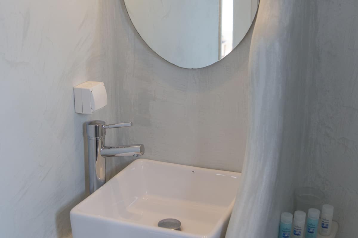 apartment, 1 bedroom, sea view | bathroom | shower, designer toiletries, hair dryer, slippers