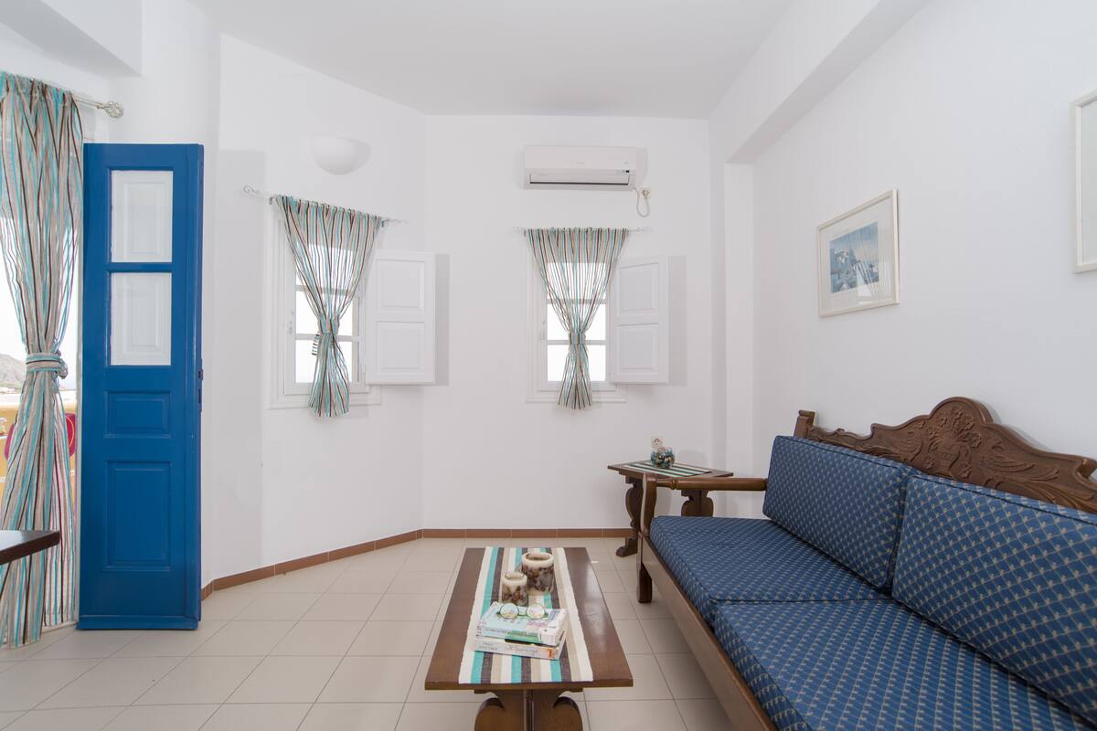 apartment, 1 bedroom, sea view | living room | flat-screen tv