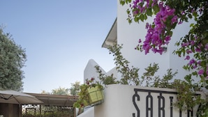 A white building with a sign reading "SARITA". - Costa Sariyaz Hotel (Bodrum)