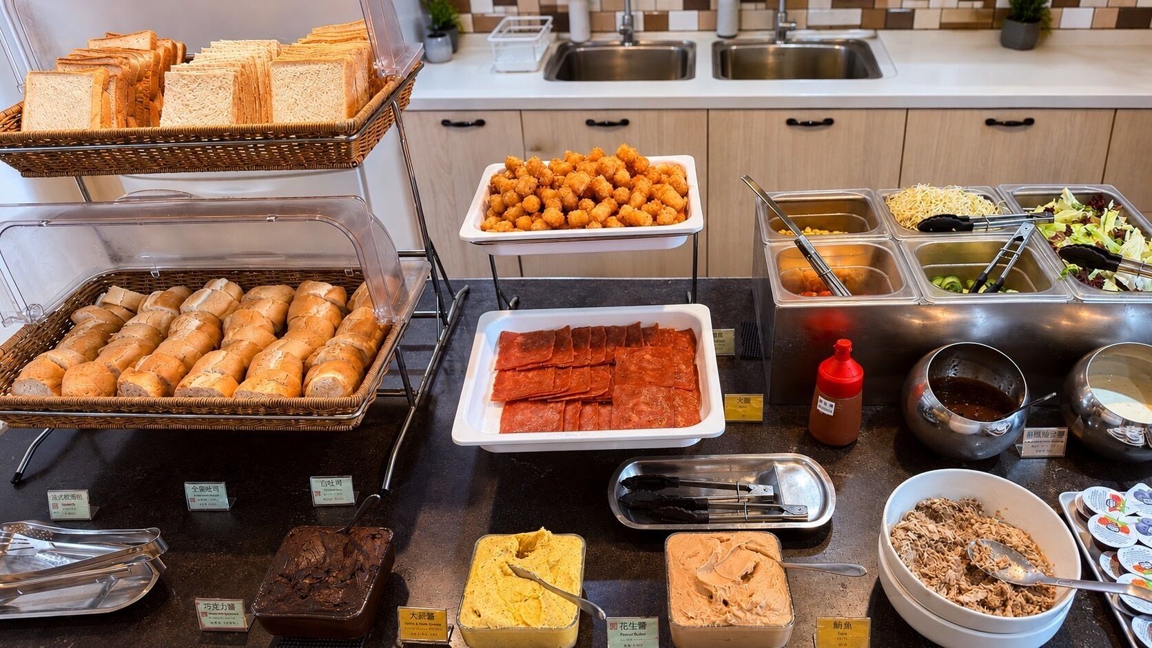 A buffet with various food items including bread, tater tots, and different sauces.
