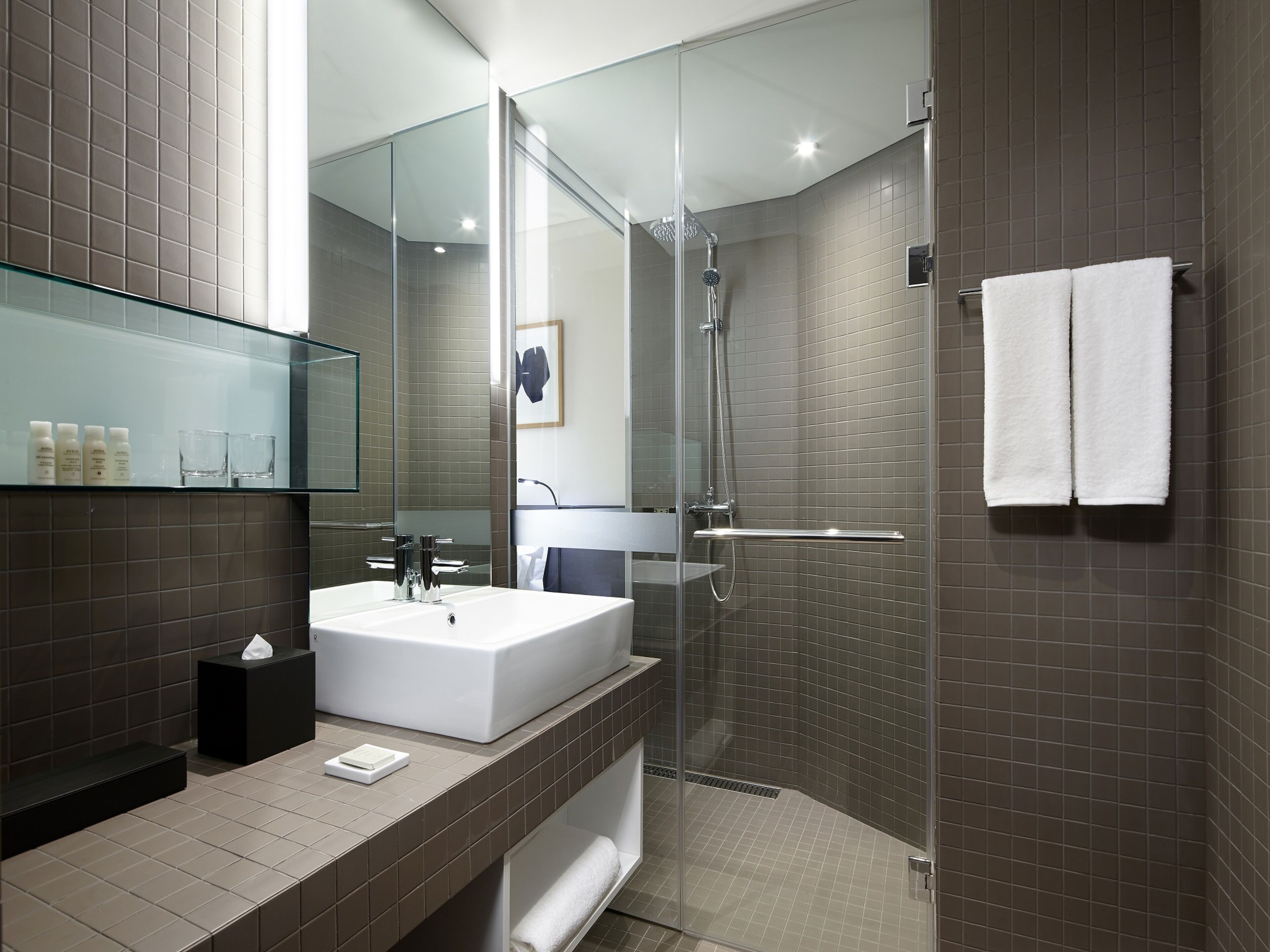 designer toiletries, hair dryer, bathrobes, slippers