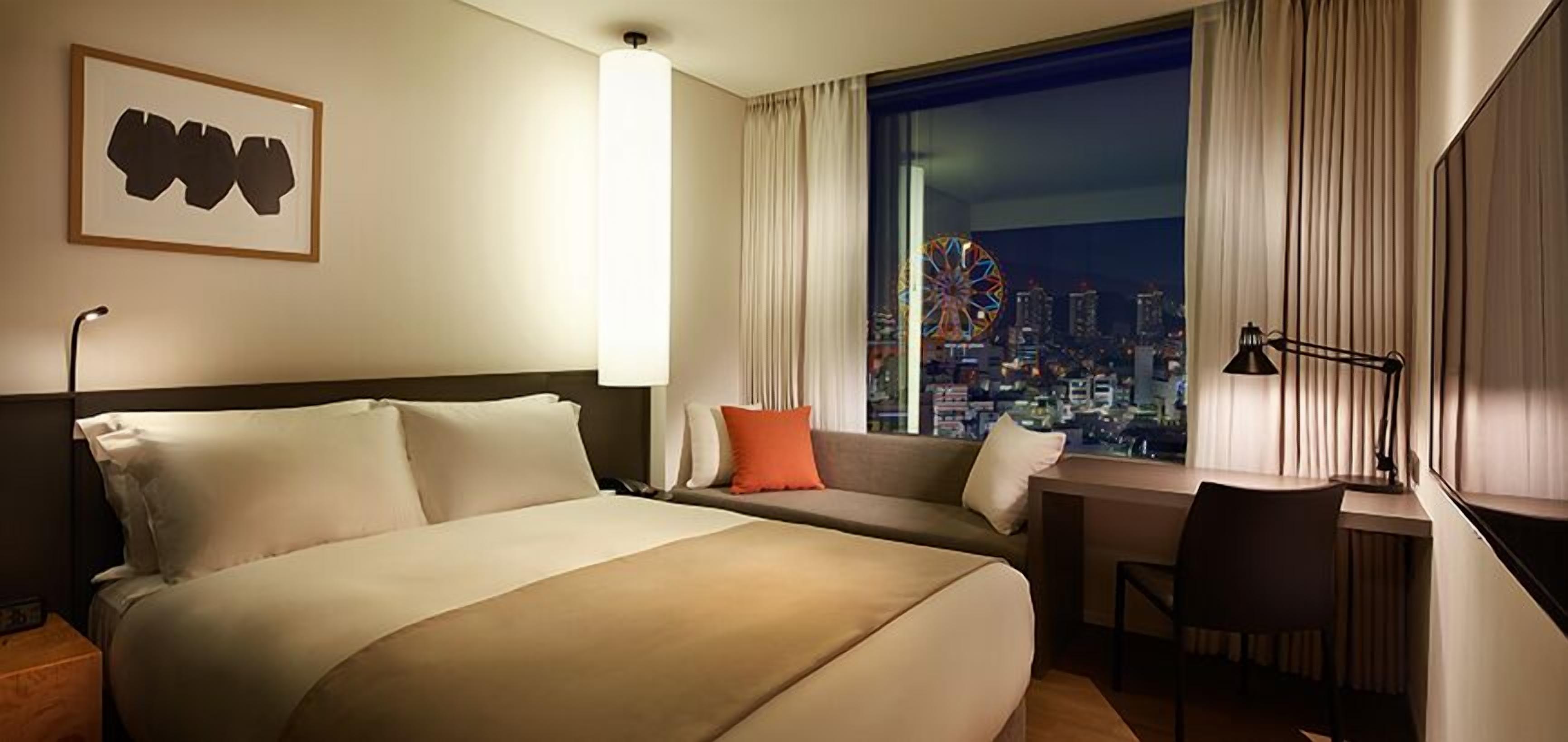 Premium bedding, in-room safe, blackout drapes, soundproofing