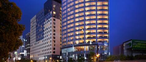 A high-rise hotel with a modern design, featuring a prominent "Shilla Stay" sign at the top.