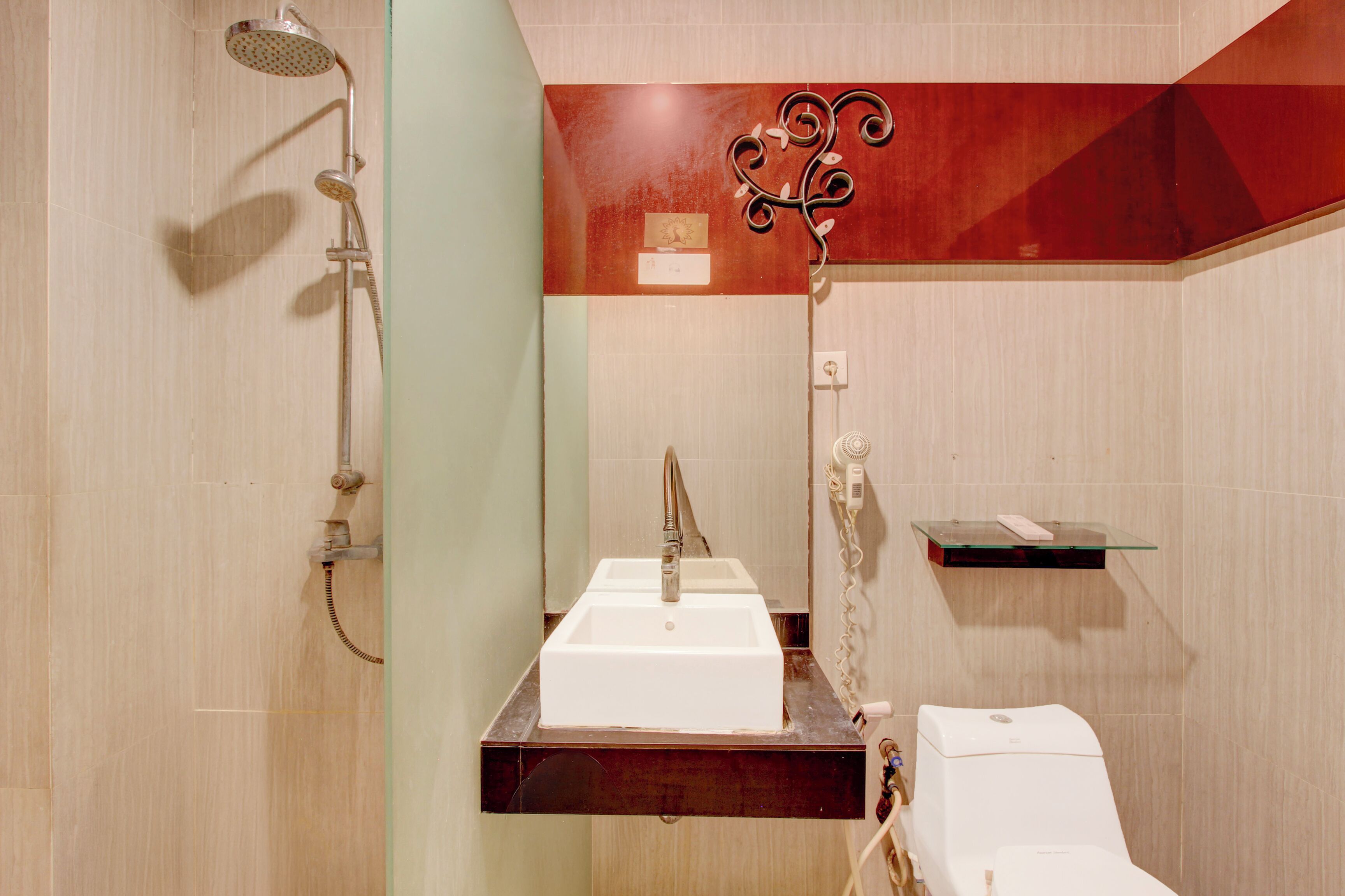 A bathroom with a shower, sink, and toilet.