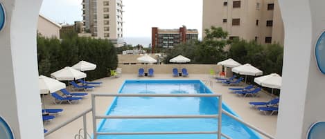 Outdoor pool, open 8:30 AM to 7:30 PM, pool umbrellas, pool loungers